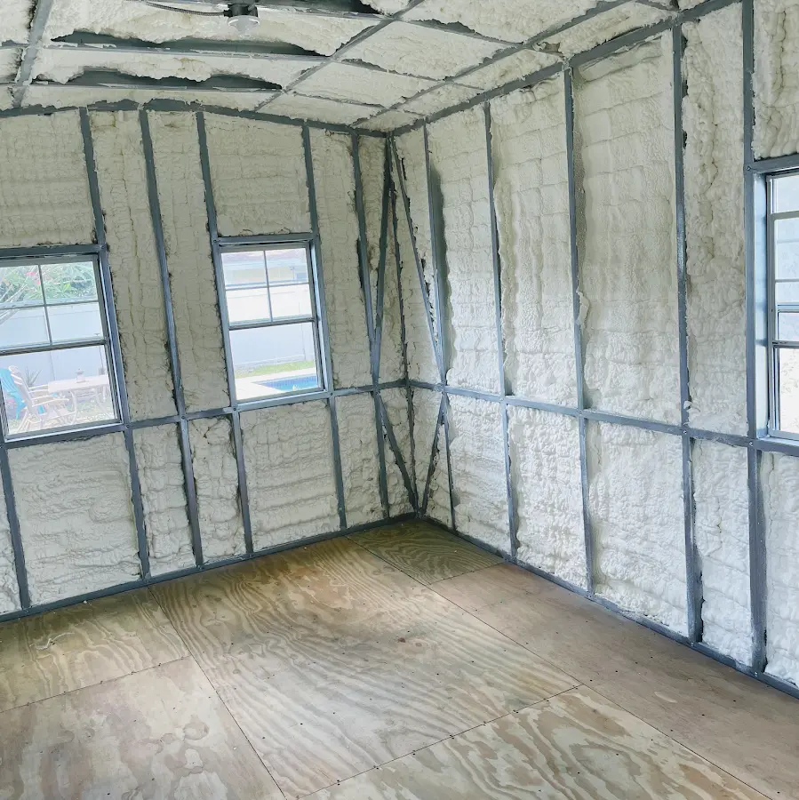 Closed-cell spray foam insulation applied to wall cavities in a residential project in Francisville